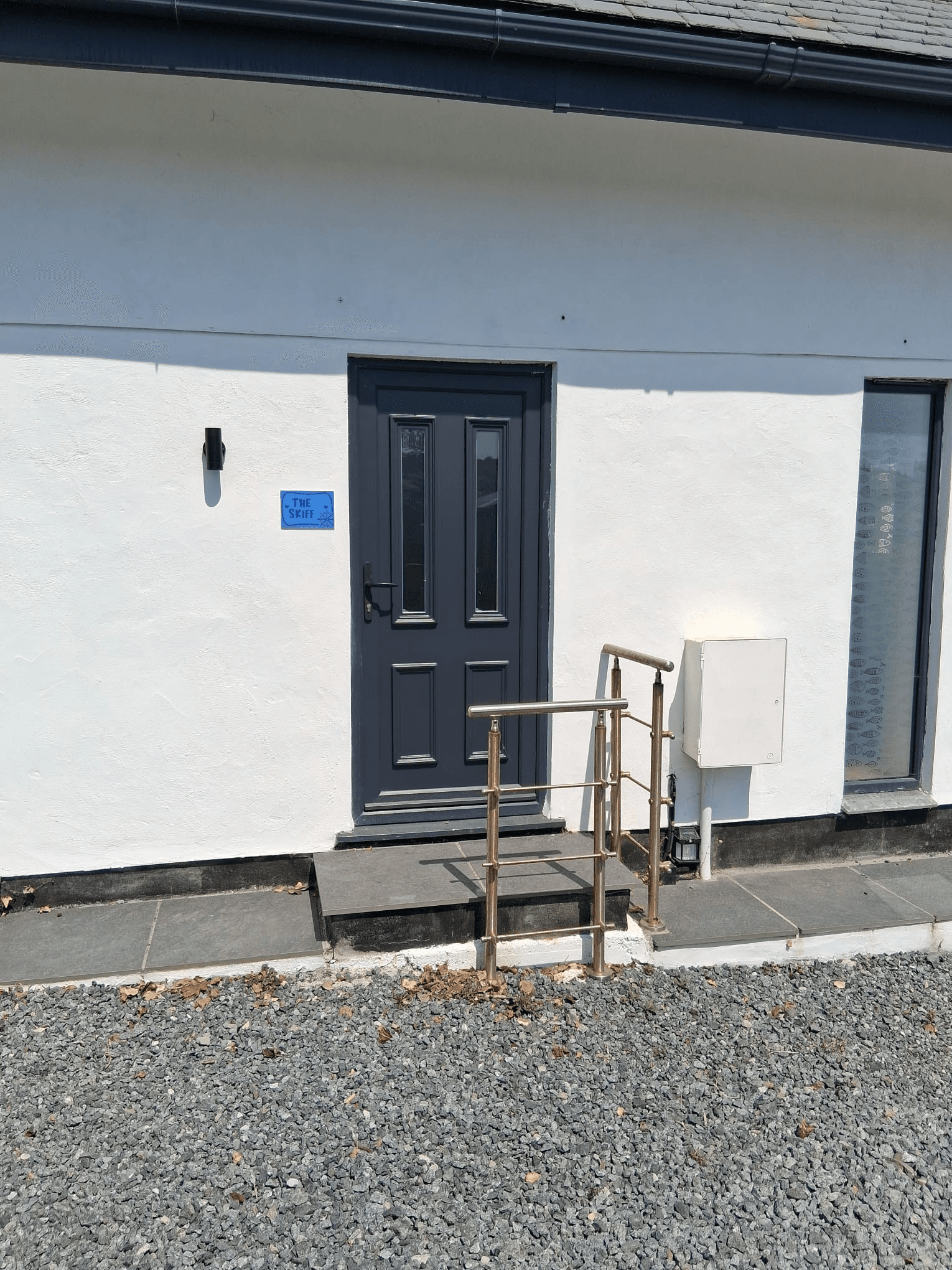 Composite door fitted to white rendered property