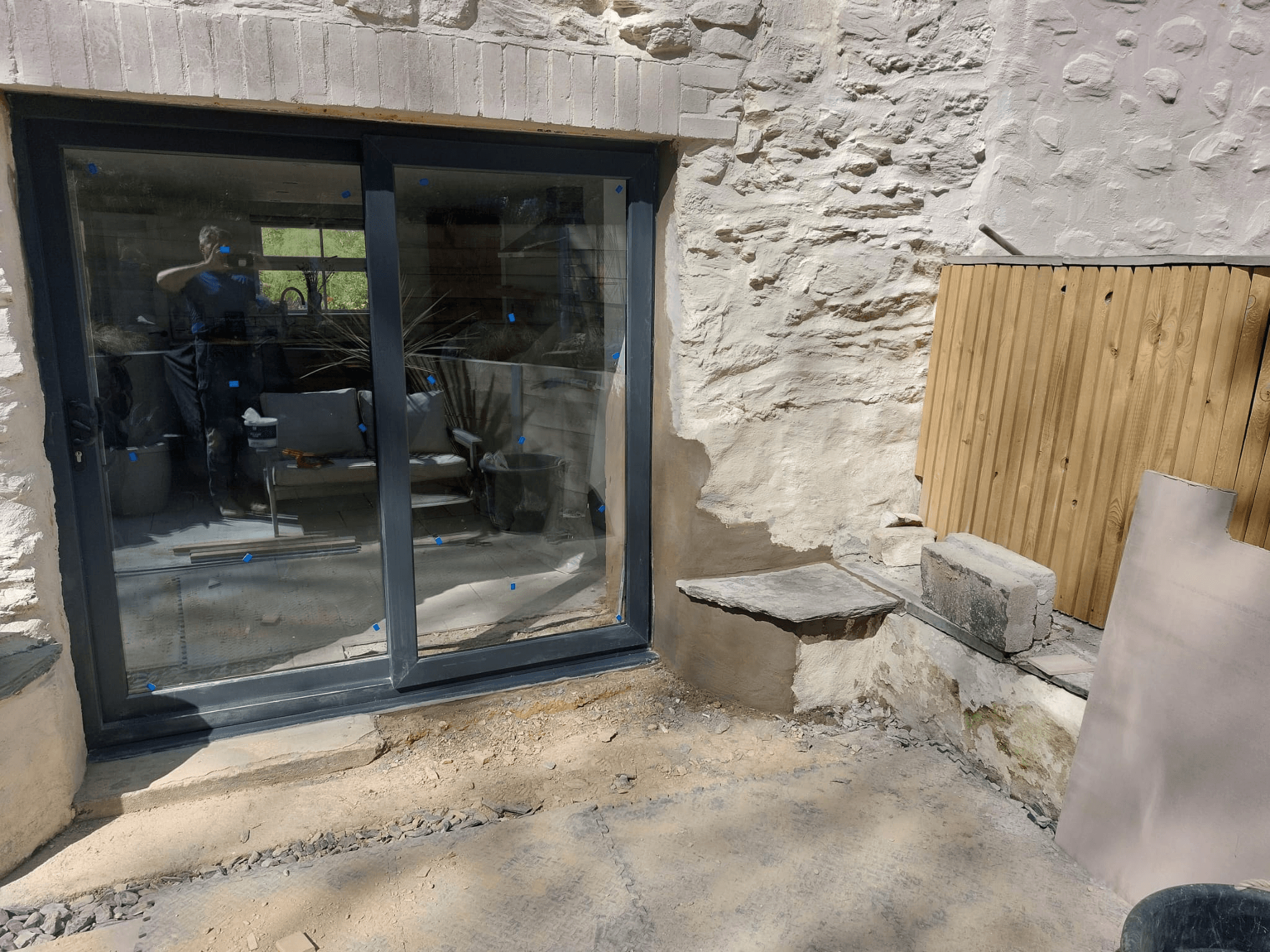 Grey patio doors fitted to stone barn conversion